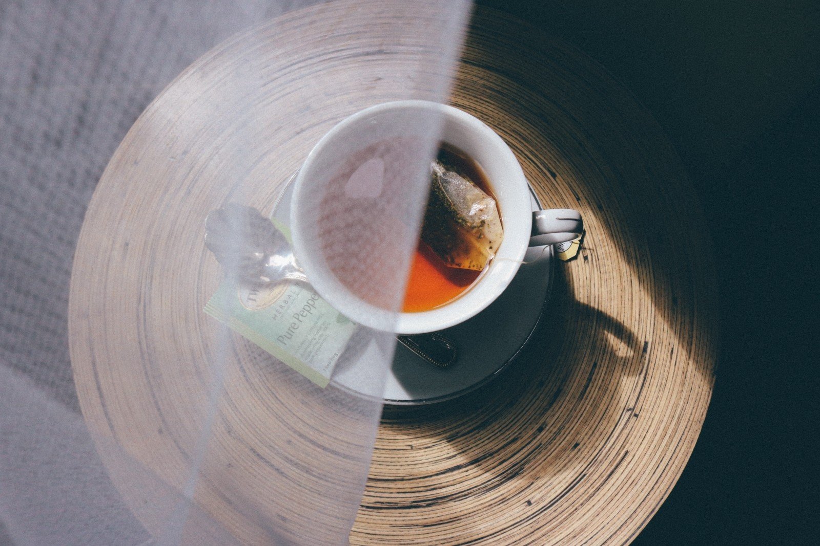 A cup of tea partially covered by veil